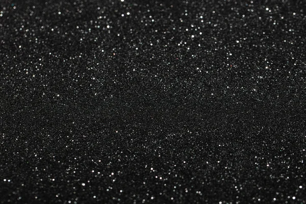 Black glitter textured patterned background