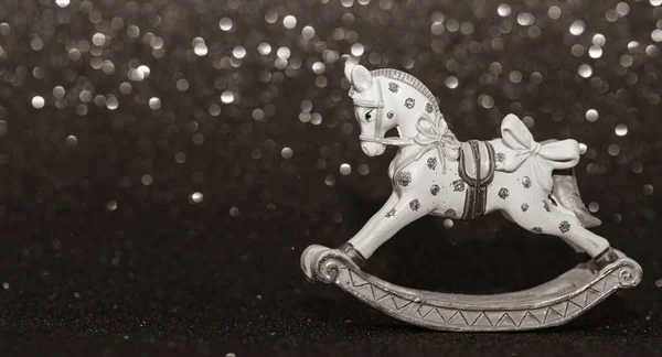 Balançando Cavalo Natal Brinquedo Fundo Glitter Sépia — Fotografia de Stock
