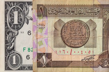 Suudi Arabistan 'ın eski bir riyali ve tasarım amaçlı 1 Amerikan doları banknotları