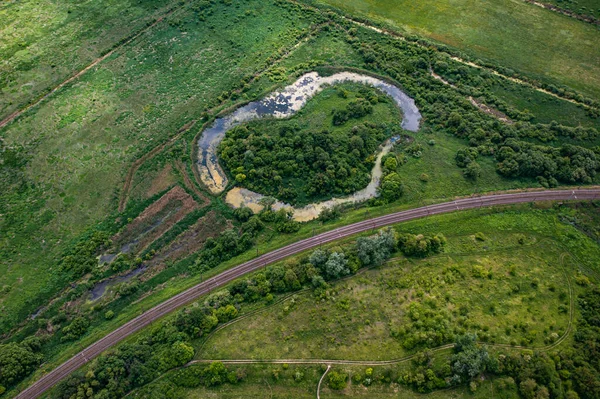 Aerial view on railway and lake from drone