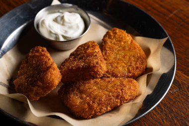 Crispy Fried Cheese Sticks or Hash Browns with White Dipping Sauce