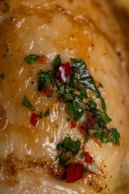Close-up of Golden Roasted Chicken Skin with Herbs and Chili