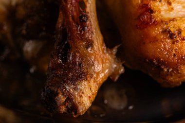 Extreme Close-up of Roasted Chicken Leg Bone and Crispy Skin
