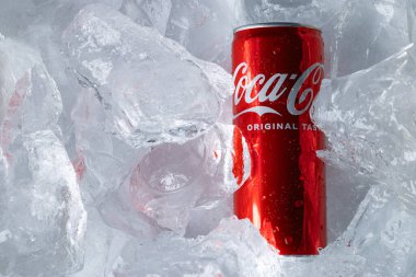 Lviv, Ukraine - February 6, 2026: Red Coca-Cola Soda Can in Ice