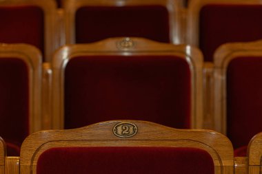Row of red seats in theatre for design purpose