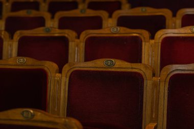 Row of red seats in theatre for design purpose