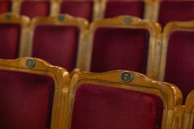 Row of red seats in theatre for design purpose