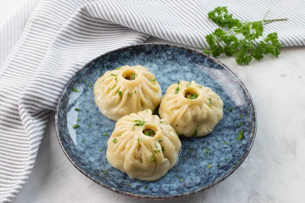 Traditional oriental food - manti with meat. The concept of Oriental cuisine.