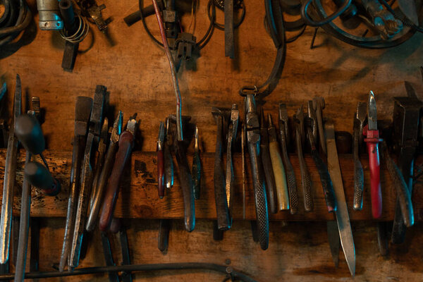A lot of old rusty instruments in vintage dirty garage. High quality photo