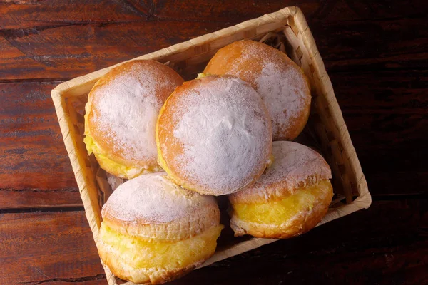 Berlin balls, known as sweet dreams in Brazil. Consists of a fried sweet dough filled with a yellow cream or pastry cream. Selective focus