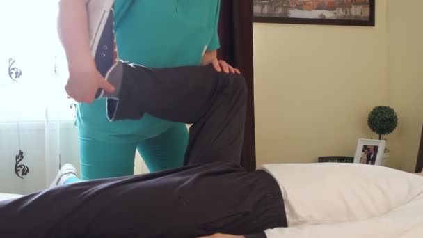 Physical therapist working with patient — Stock Video