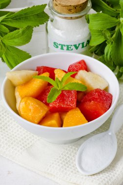 Fruit Salad and Stevia Powder. Natural Sweetener. clipart