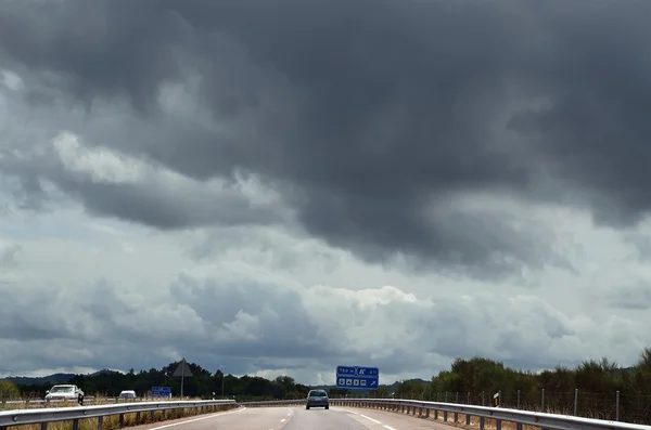 Highway and storm clouds — Stock Photo, Image