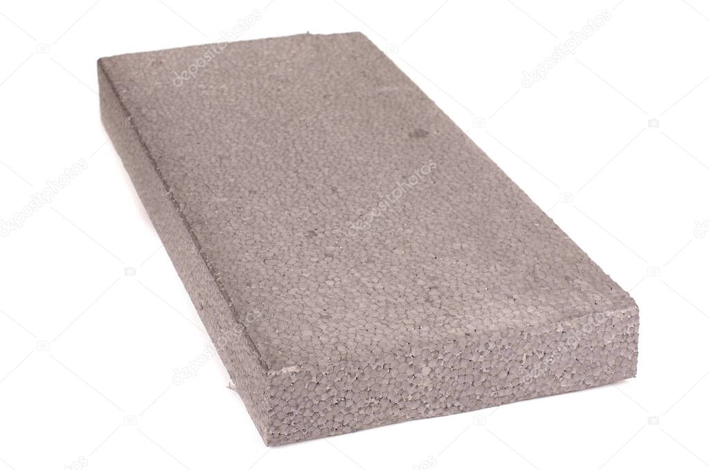 Block of thermal insulation with graphite polystyrene for thermal insulation of house walls isolated on the white background