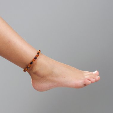 Girl foot isolated on the grey background clipart