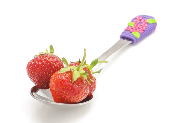 Strawberry in the spoon isolated on the white background — Stock Photo, Image