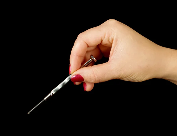 Female hand holding small philips screwdriver — Stock Photo, Image