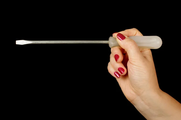 Woman hand holding flat screwdriver — Stock Photo, Image