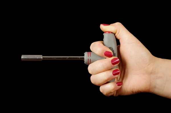 Female hand holding T lug wrench — Stock Photo, Image