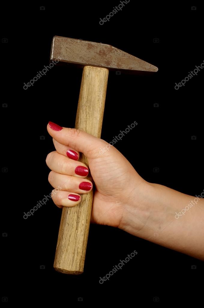Female constructions worker hand holding hammer — Stock Photo © amphoto