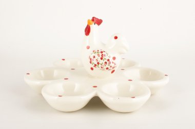 White glossy porcelain 6 eggs holder on the white background clipart