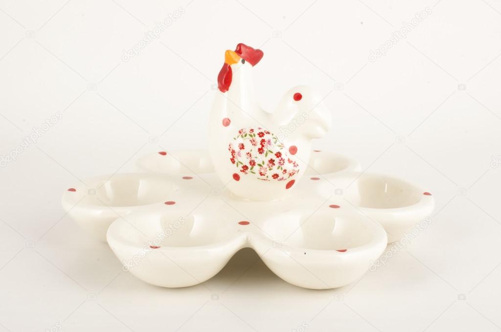 White glossy porcelain 6 eggs holder on the white background