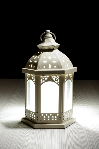 Lantern on the bright wood background — Stock Photo, Image