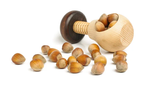 Nut cracker full of hazelnuts on the white background — Stock Photo, Image