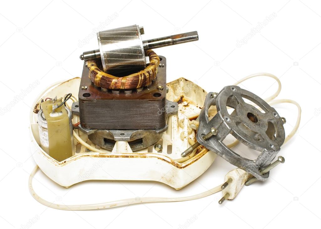 Old juicer motor deconstructed isolated on the white background
