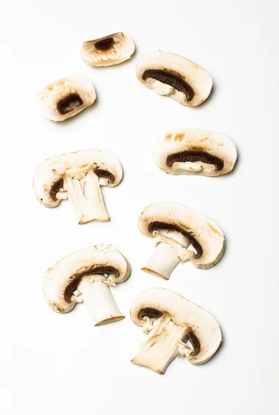 Raw champignon mushroom slices on the bright background — Stock Photo, Image