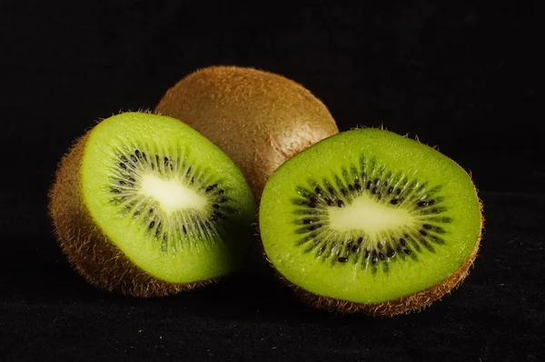 Kiwi fruit isolated on the dark background — Stock Photo, Image