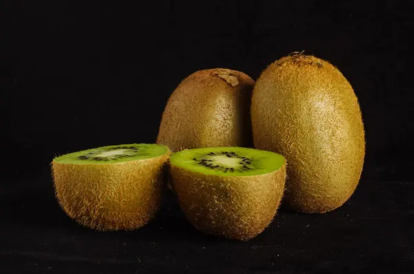 Kiwi fruit isolated on the black background — Stock Photo, Image