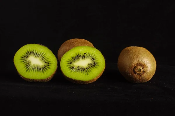 Kiwifruit isolated on the dark background — Stock Photo, Image