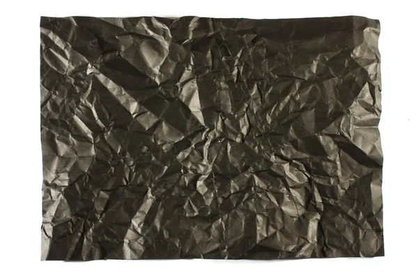 Rynkor på svart papper ytan — Stockfoto