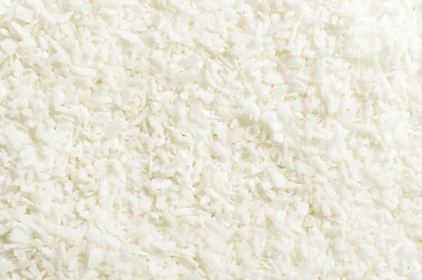 Shredded coconut shavings abstract texture background — Stock Photo, Image