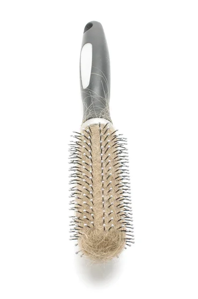 Hairbrush with hairs on the white background — Stock Photo, Image