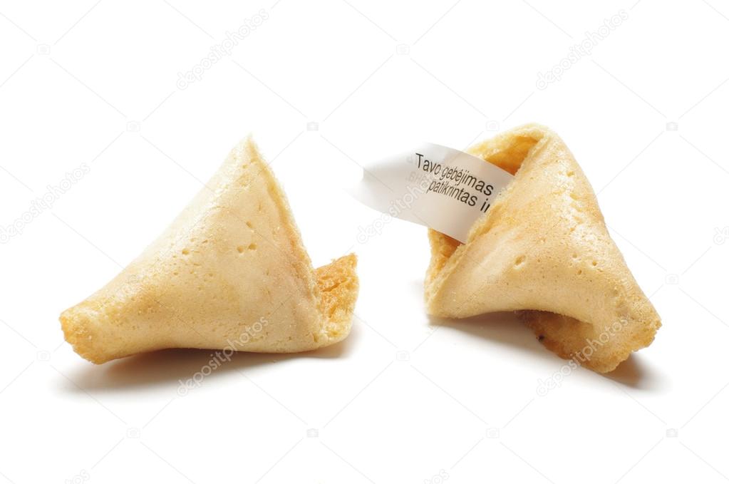 Open fortune cookie with phrase of wisdom inside