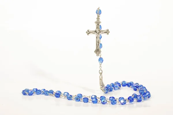 Religion concept flying cross over rosary — Stock Photo, Image