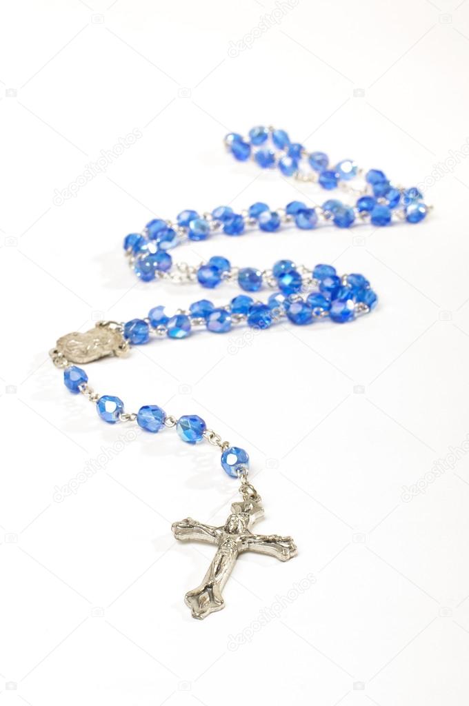 Religion symbol rosary with silver cross isolated