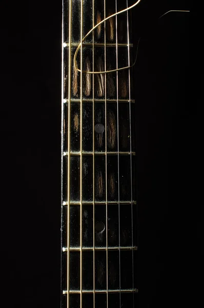 Acoustic 6 string guitar fretboard isolated on the black background — Stock Photo, Image