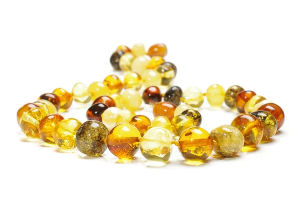 Stylish various colors amber necklace isolated close up — Stock Photo, Image