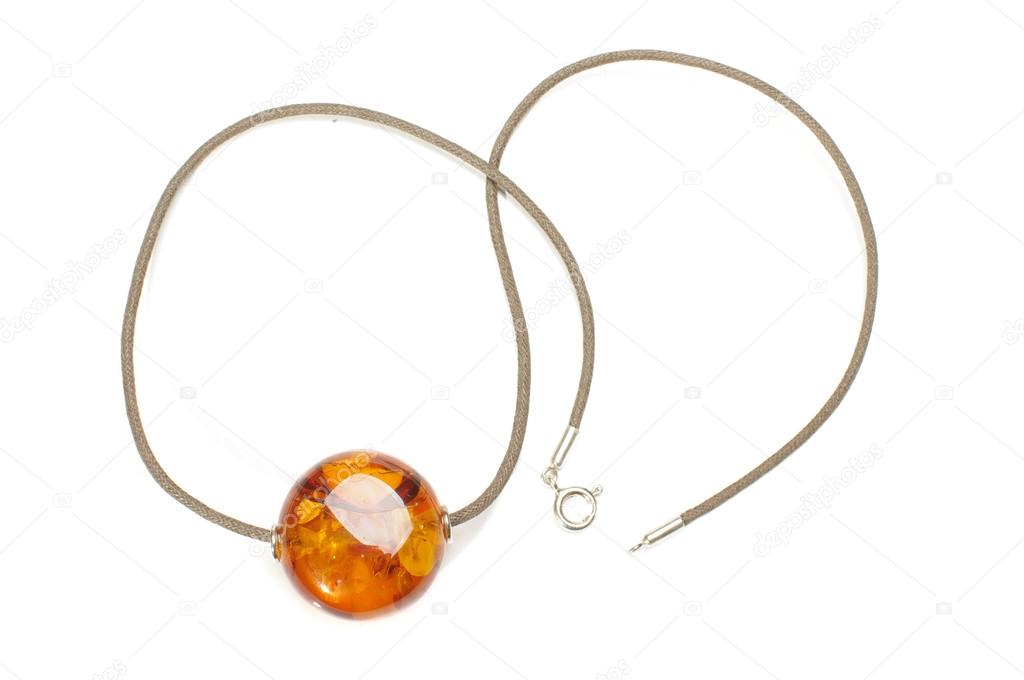 Natural amber pendant isolated on the white background