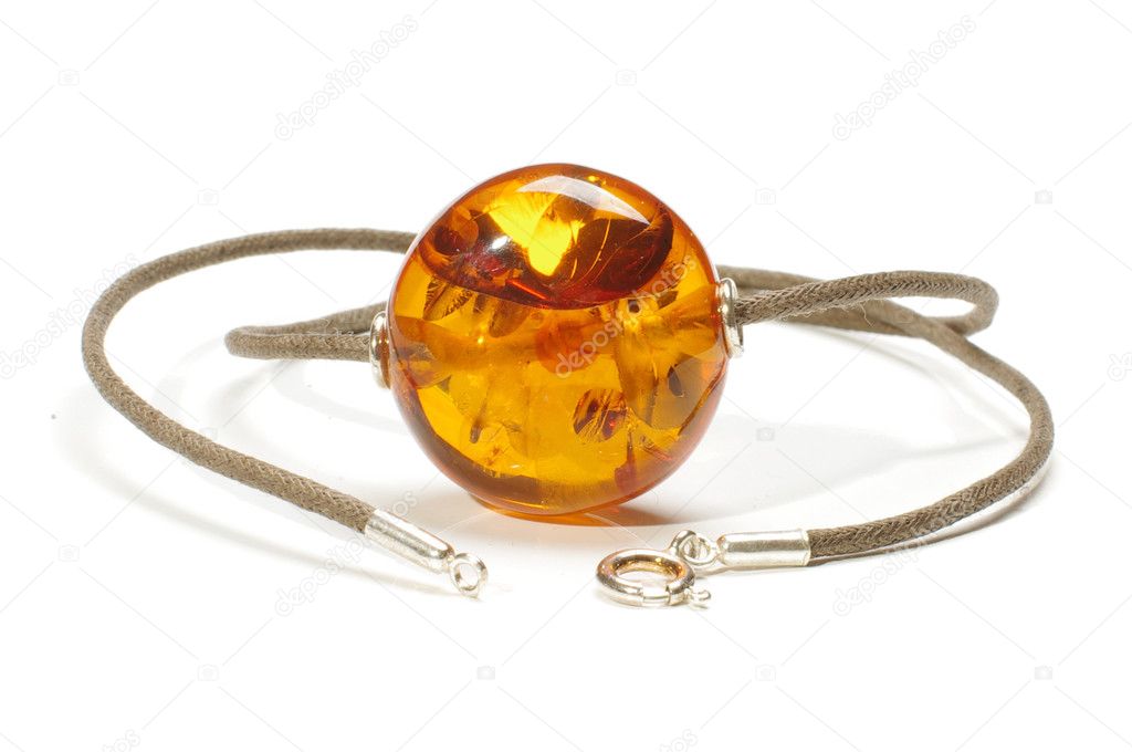 Amber charm isolated on the white background