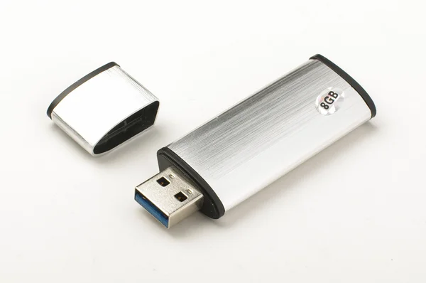 Flash stick metalic aluminium geïsoleerd op de lichte achtergrond grijs — Stockfoto