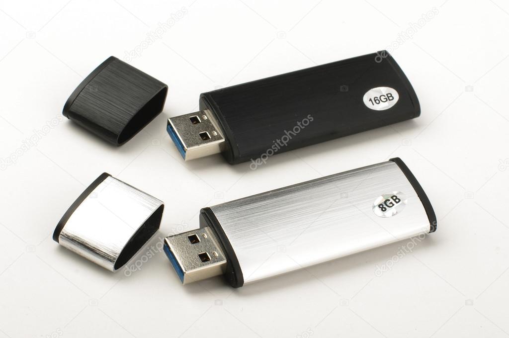 Two USB flash drives isolated on the bright background