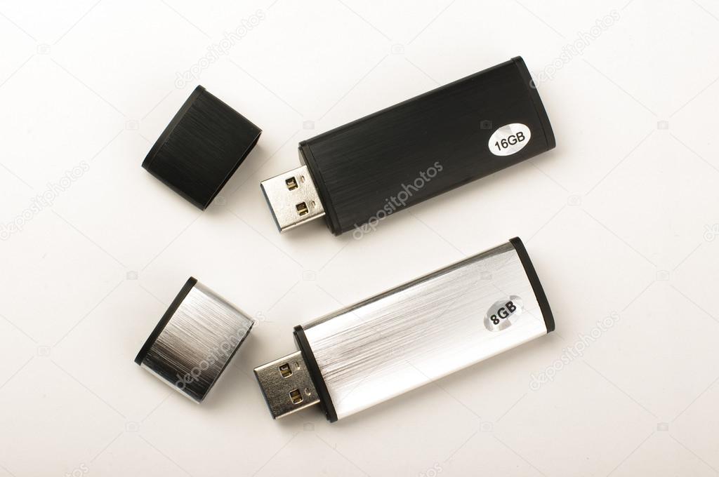 Two USB pen drives isolated on the bright background