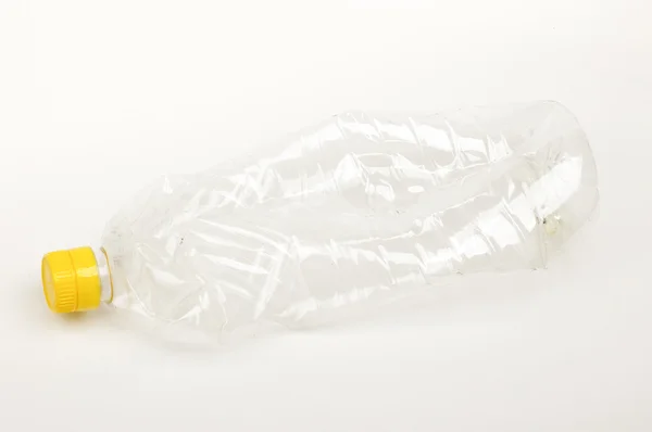 Dirty plastic bottle from oil isolated on the bright background — Stock Photo, Image