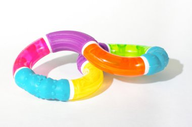 Bebek oyuncak ve parlak arka plan üzerinde izole teether