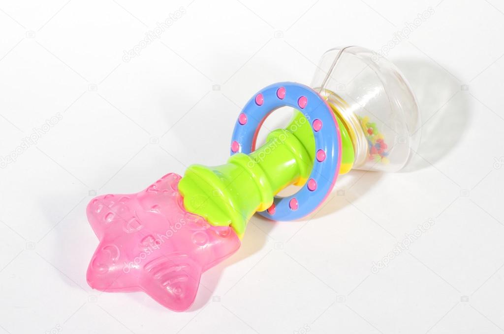 Baby rattle with teether isolated on the white background