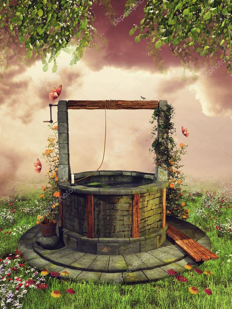 Old wishing well with spring flowers Stock Photo by ©FairytaleDesign